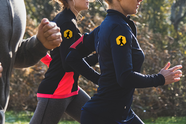 Marathon runner wearing a custom badge