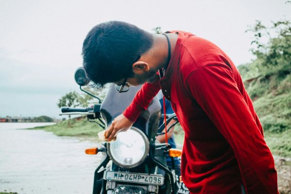 A man cleaning his motorcycle