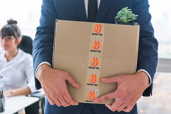Business man shipping box branded with packaging tape