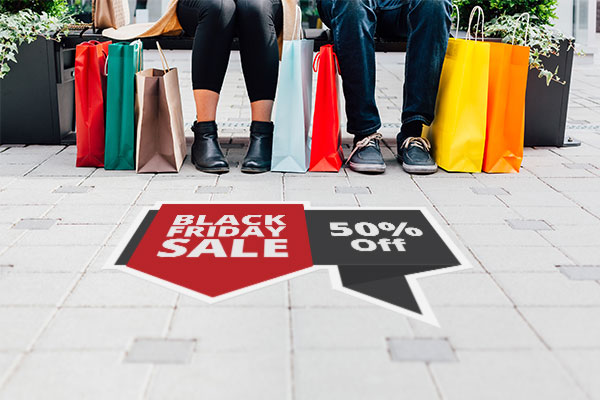 Decal on sidewalk advertising a Black Friday sale.