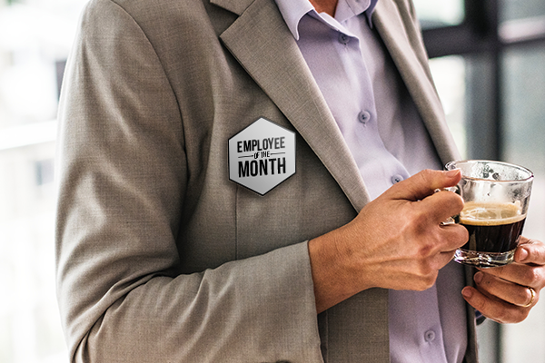 Employee of the month badge being worn