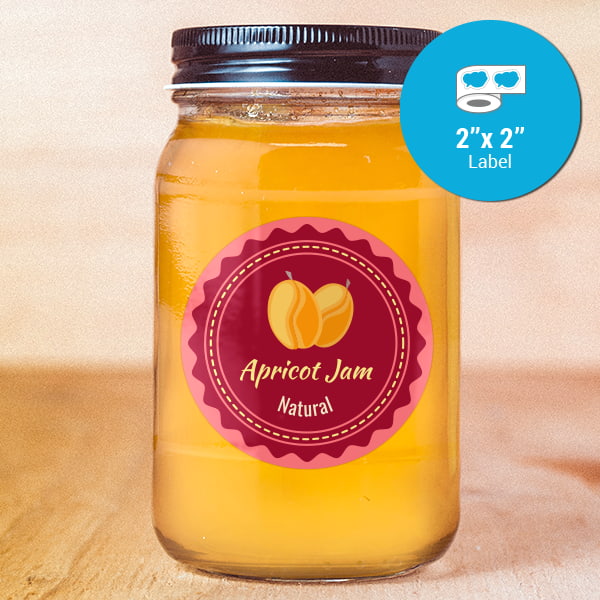 Round sticker applied to a glass jar full of apricot jam.