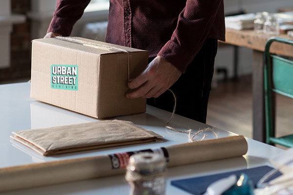 Man preparing package for shipping.