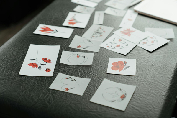 Many floral temporary tattoos on a table.