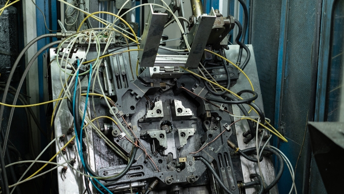 Die of a multi-slide hot chamber die casting machine