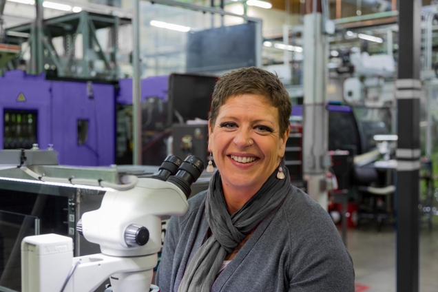 Female OptiMIM employee in a facility