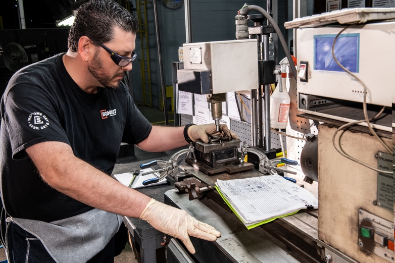 Signicast engineer inspecting a part