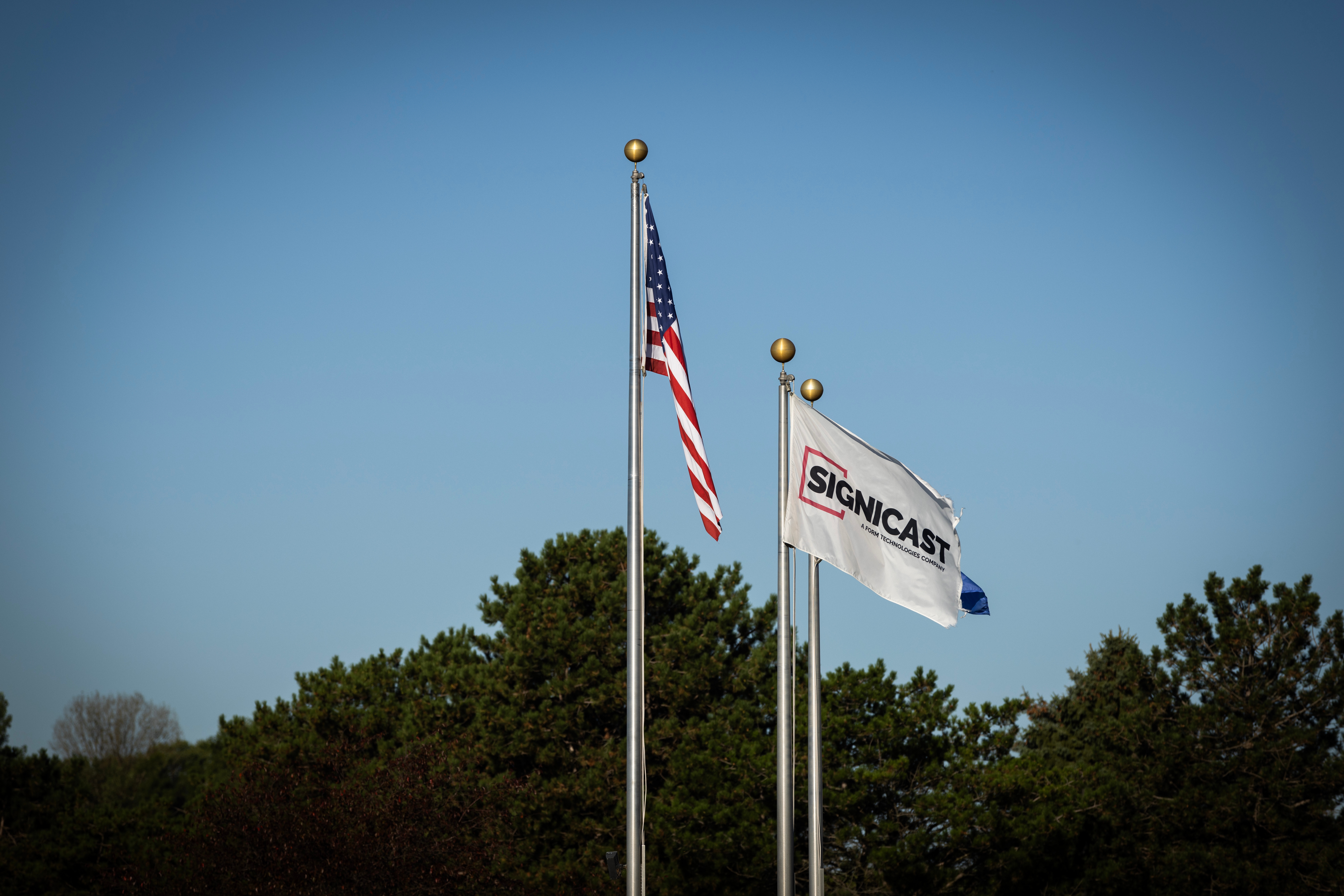 Flags in front of a Signicast facility