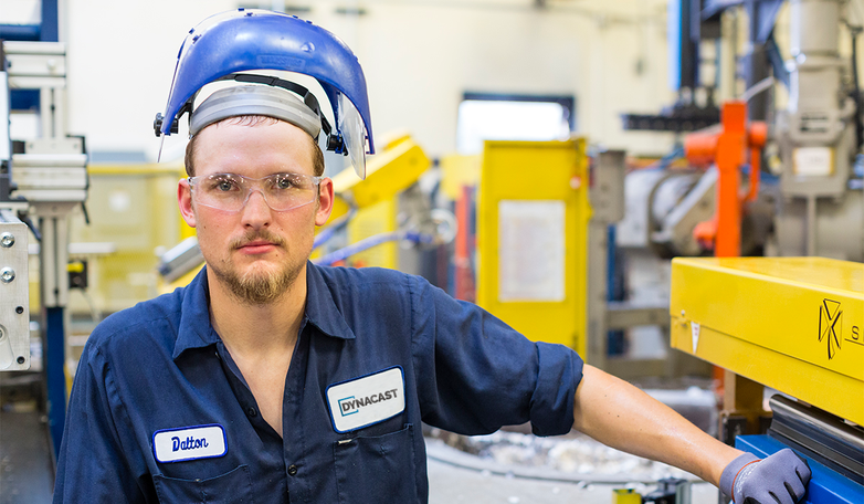 Dynacast manufacturing employee with protective gear