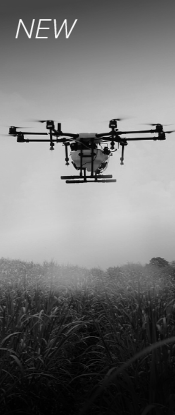 Agricultural drone spraying field with pesticides.