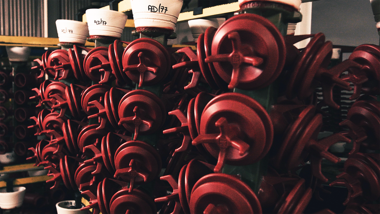 A group of red investment casting molds