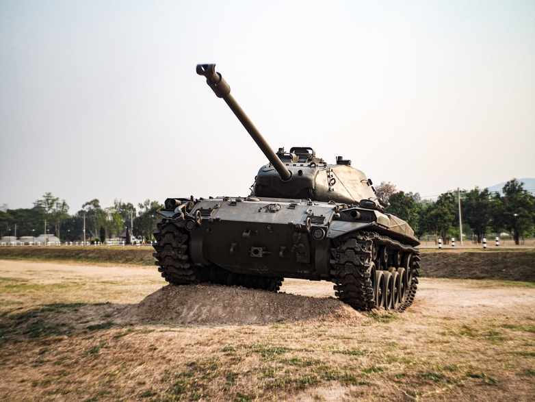Army tank on a dirt hill