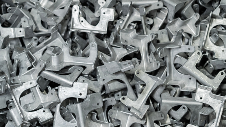 Metal die casted parts in a pile