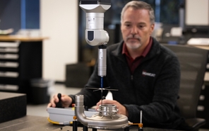 Engineer navigating a machine in the prototype lab