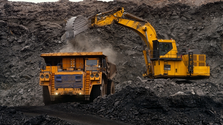 Construction site with an excavator and dump truck