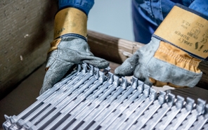 Manufacturing employee operating equipment in Peterborough