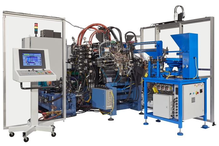 An open die casting machine in the cell