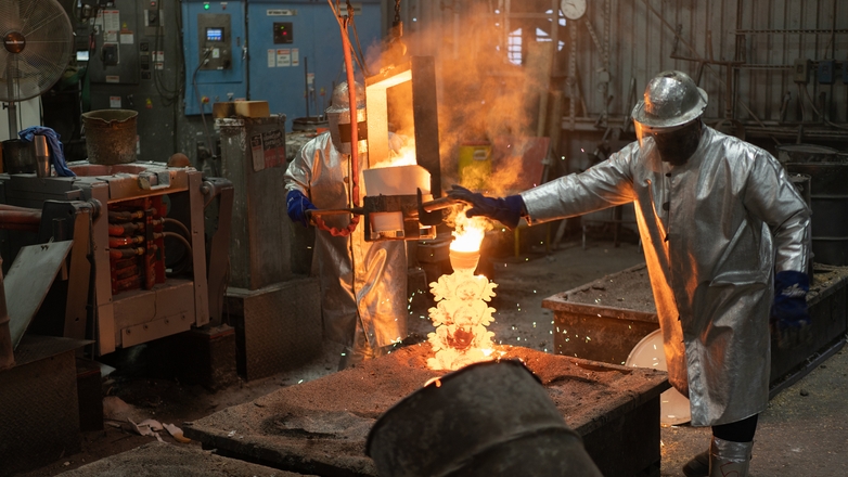Molten metal being poured into an investment casting mold