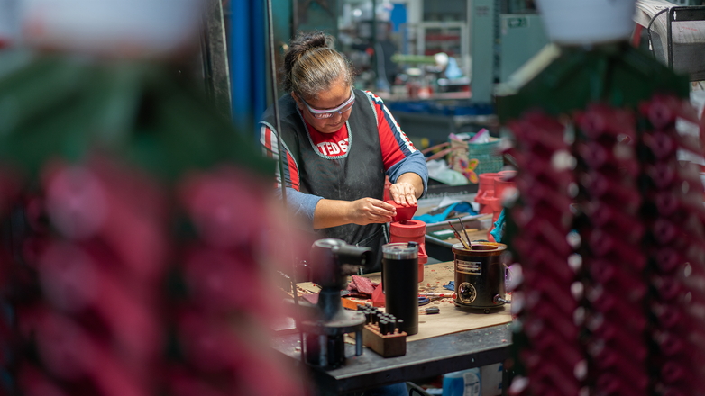 Signicast employee inspecting a mold