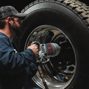 2850MAX-6 air impact wrench tightening a lug nut on a heavy truck