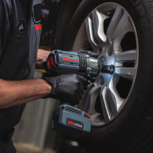 W7152 1/2" Cordless Impact Wrench tightening lug nuts on a passenger vehicle tire