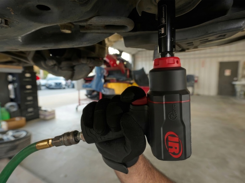 2236qxpa pneumatic dxs impact wrench working on the underbody of a car