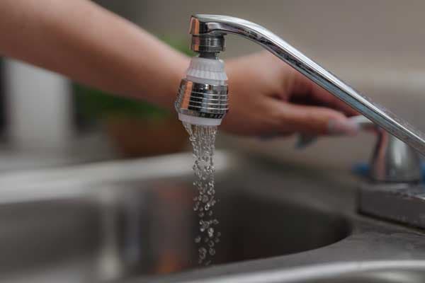 using a water saving device on a faucet