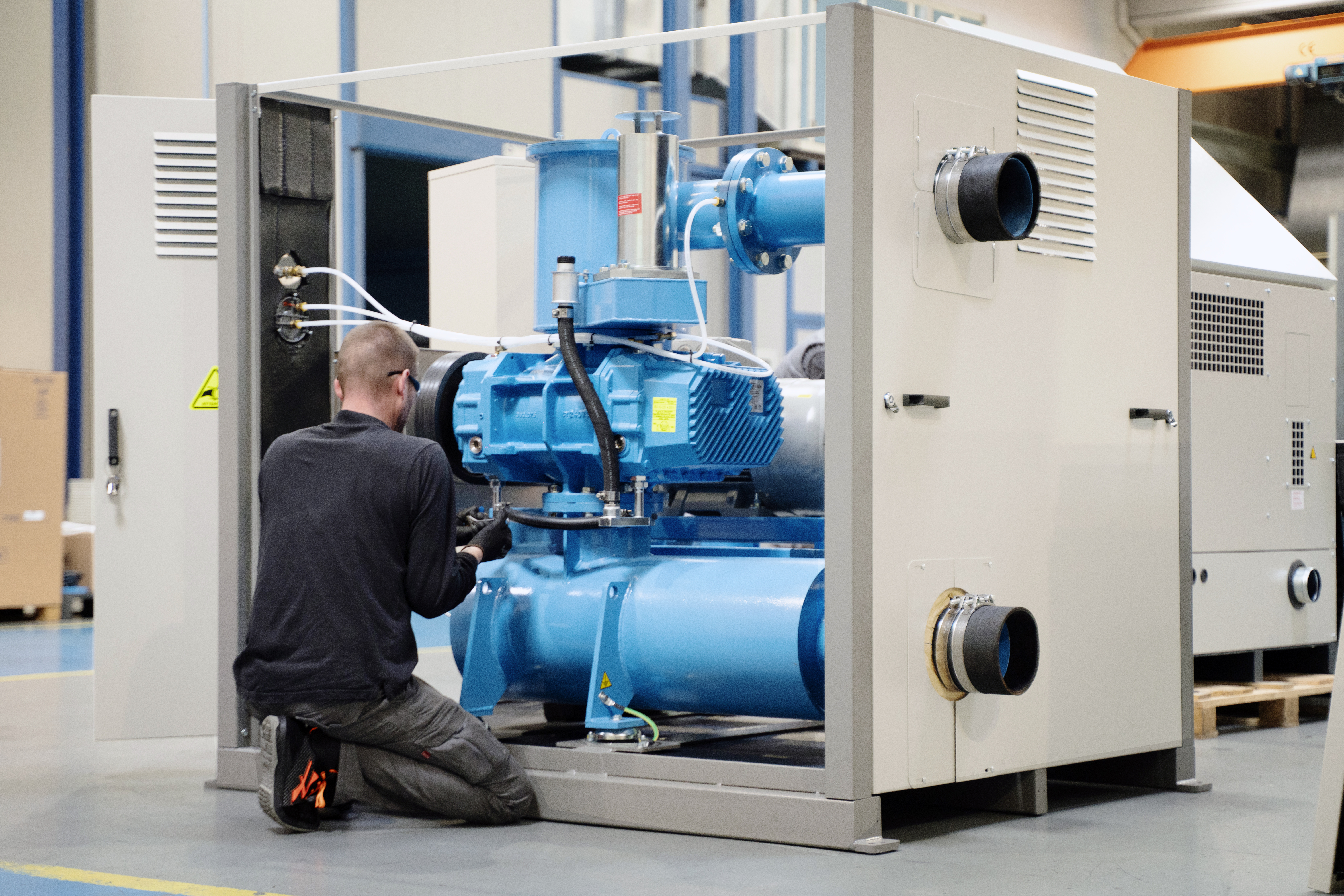 Technician servicing a blower
