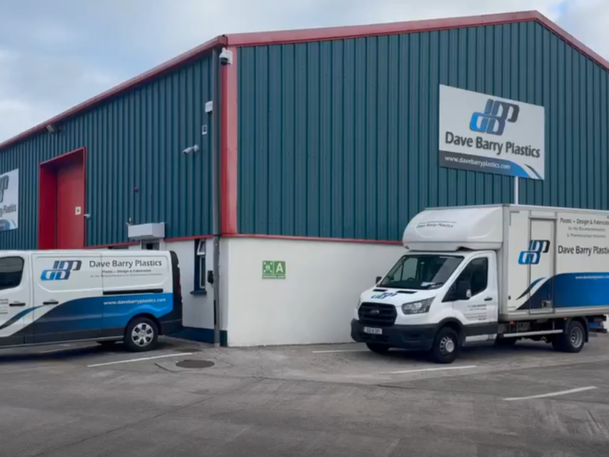 plastics factory with trucks in front