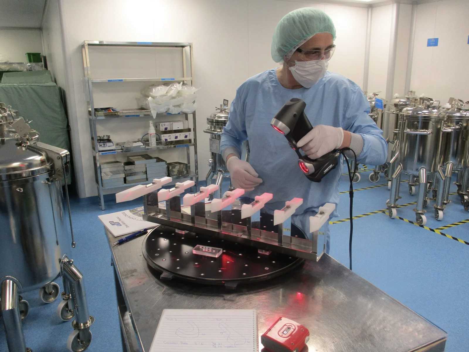 a man with a red laser